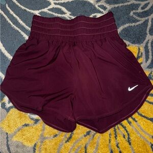 NWT Nike high waisted training short in burgundy size M
Loose short dri fit
